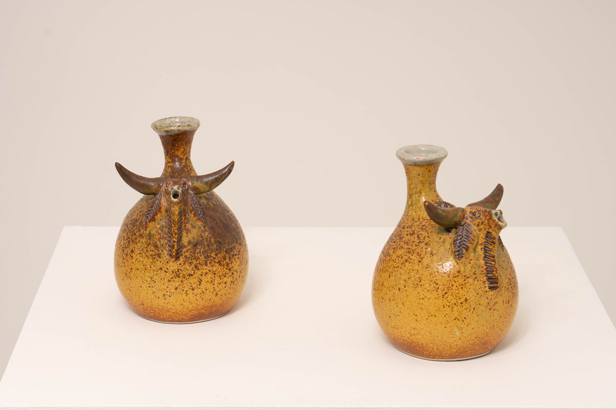 PAIR OF CERAMIC BULL VASES BY JORGE MEALHA
