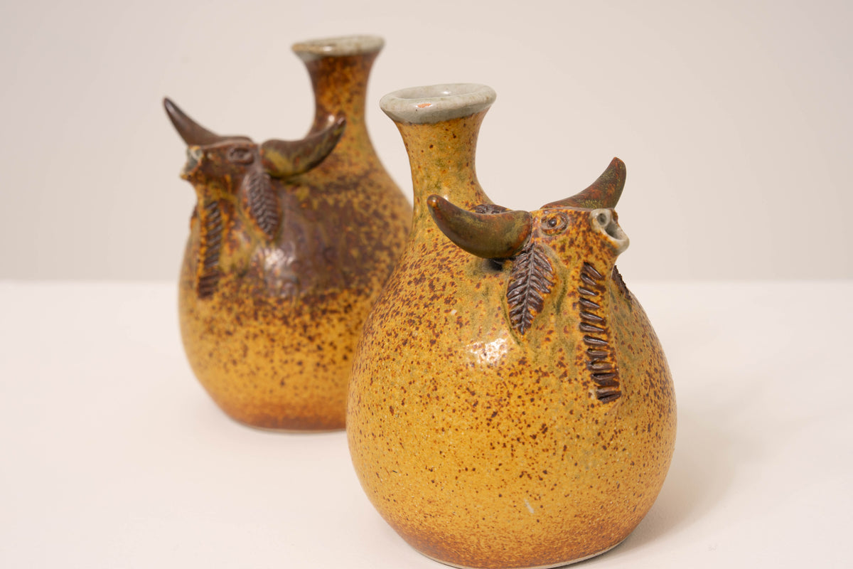 PAIR OF CERAMIC BULL VASES BY JORGE MEALHA