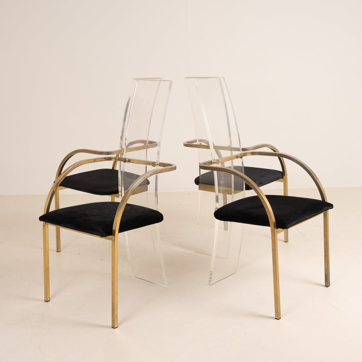 SET OF FOUR ACRYLIC AND BRASS CHAIRS BY BELGO CHROME