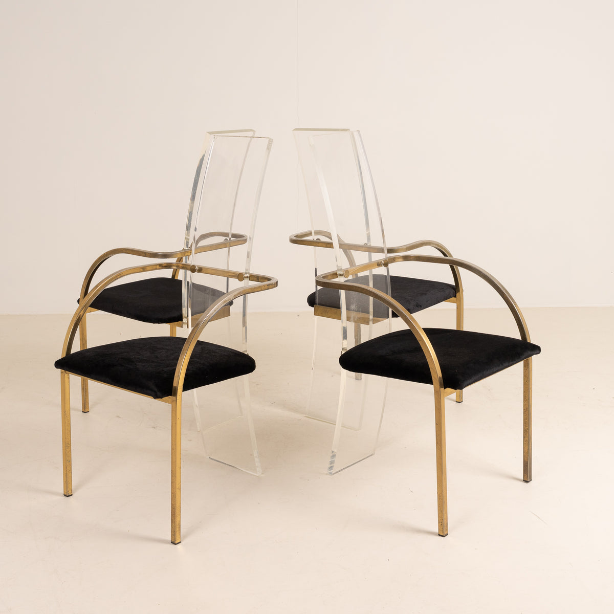 SET OF FOUR ACRYLIC AND BRASS CHAIRS BY BELGO CHROME