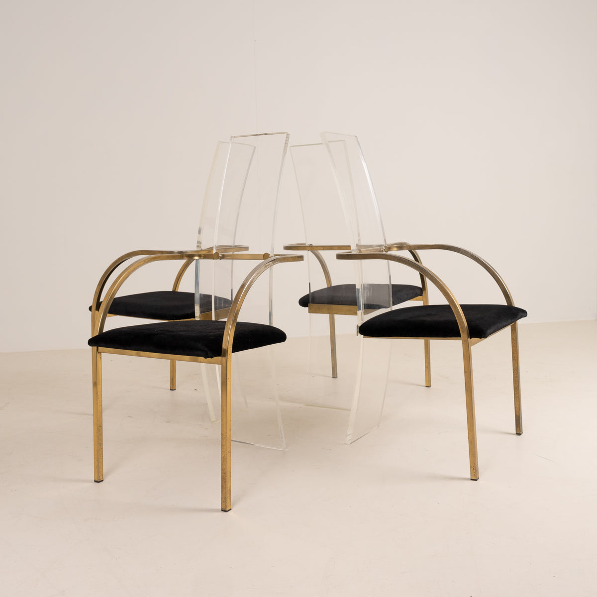 SET OF FOUR ACRYLIC AND BRASS CHAIRS BY BELGO CHROME